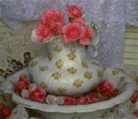 Rose arrangment in antique pitcher